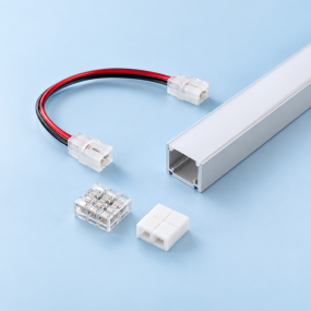 LED strip connectors, wiring and an aluminum profile on a light blue background